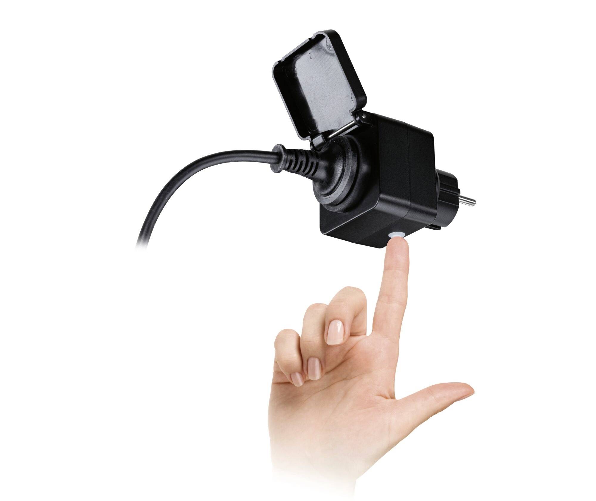 A smart plug with its cover open is being operated by a hand.