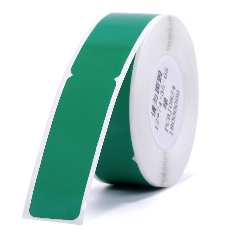 Green label roll with rectangular stickers, used for labelling or marking purposes.