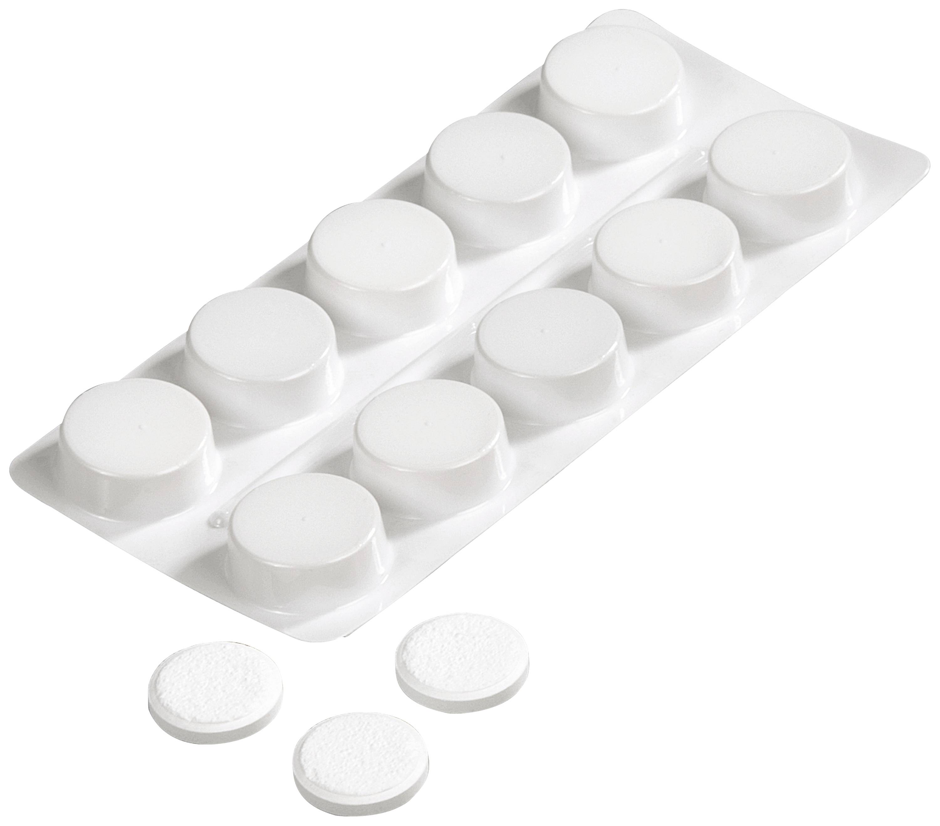 Blister pack with white tablets. Three tablets are lying outside the packaging.