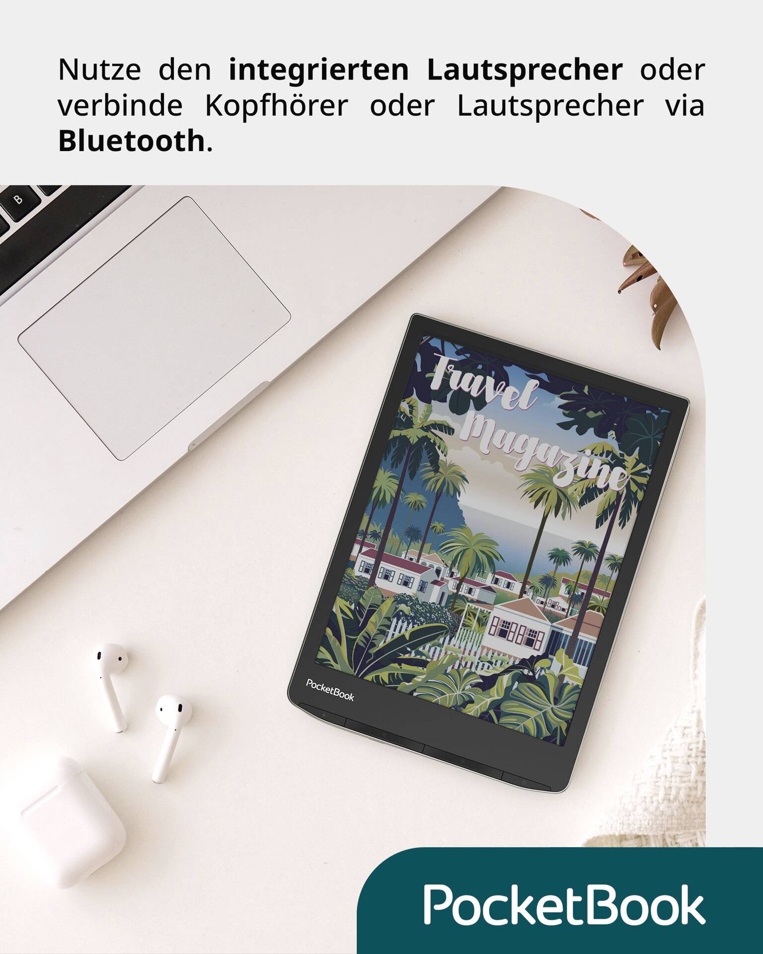 On a table lie a laptop, wireless headphones and a tablet displaying a 'Travel Magazine'. At the top it states that an integrated speaker or Bluetooth can be used.