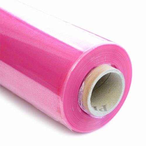 Roll of pink plastic film, partially unrolled.