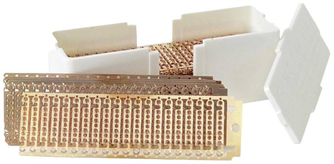 Metal strips with numerous small rings in a white plastic box, partially opened.