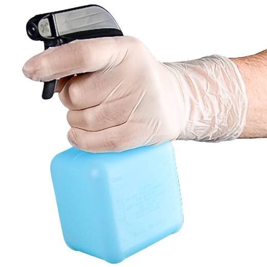 Gloved hand holding a spray bottle, aiming the nozzle downward, suggesting cleaning or disinfecting.
