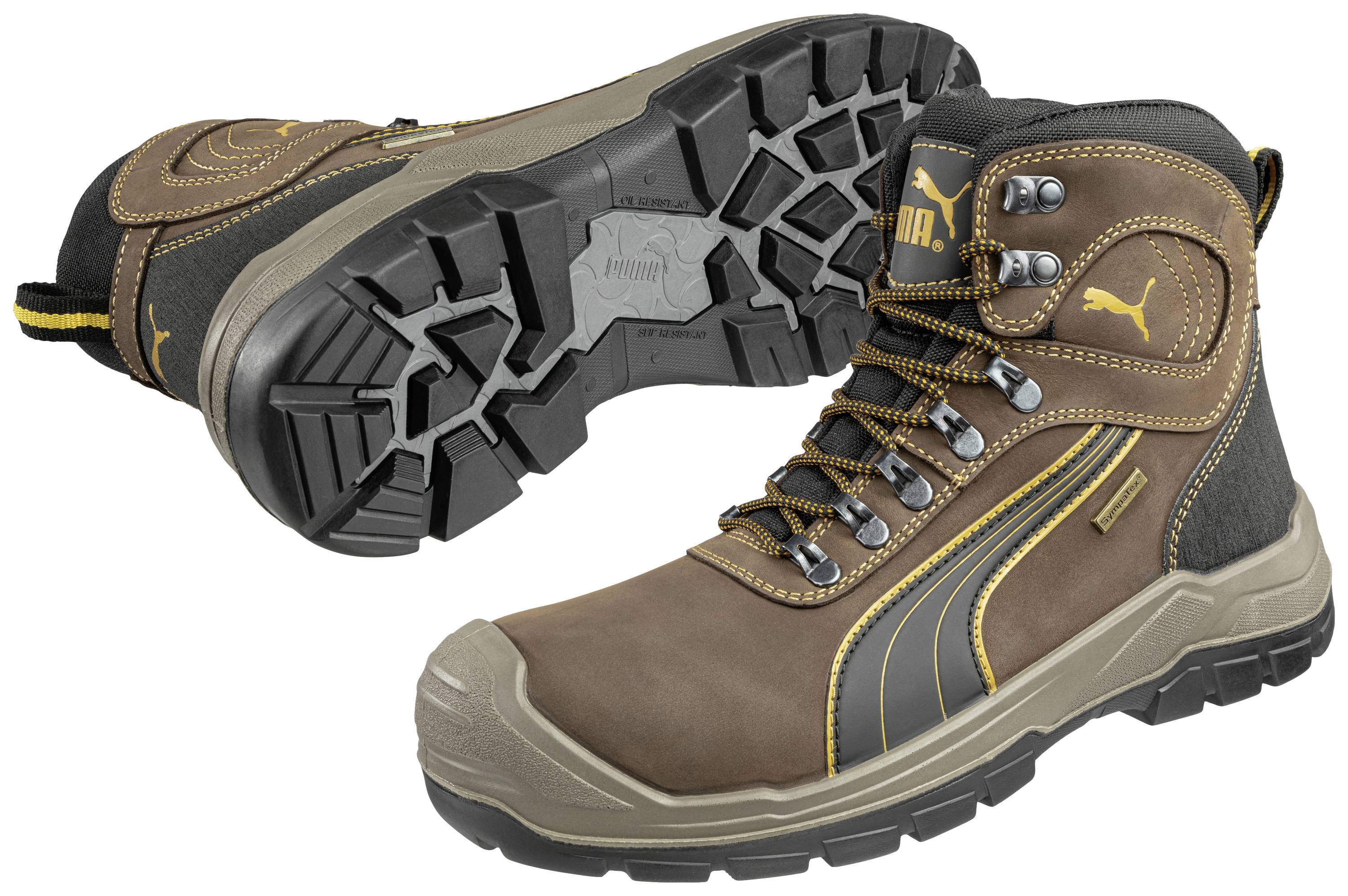A pair of brown, robust work shoes with yellow accents and a thick, non-slip sole, one shoe shown from the side, the other lying down.