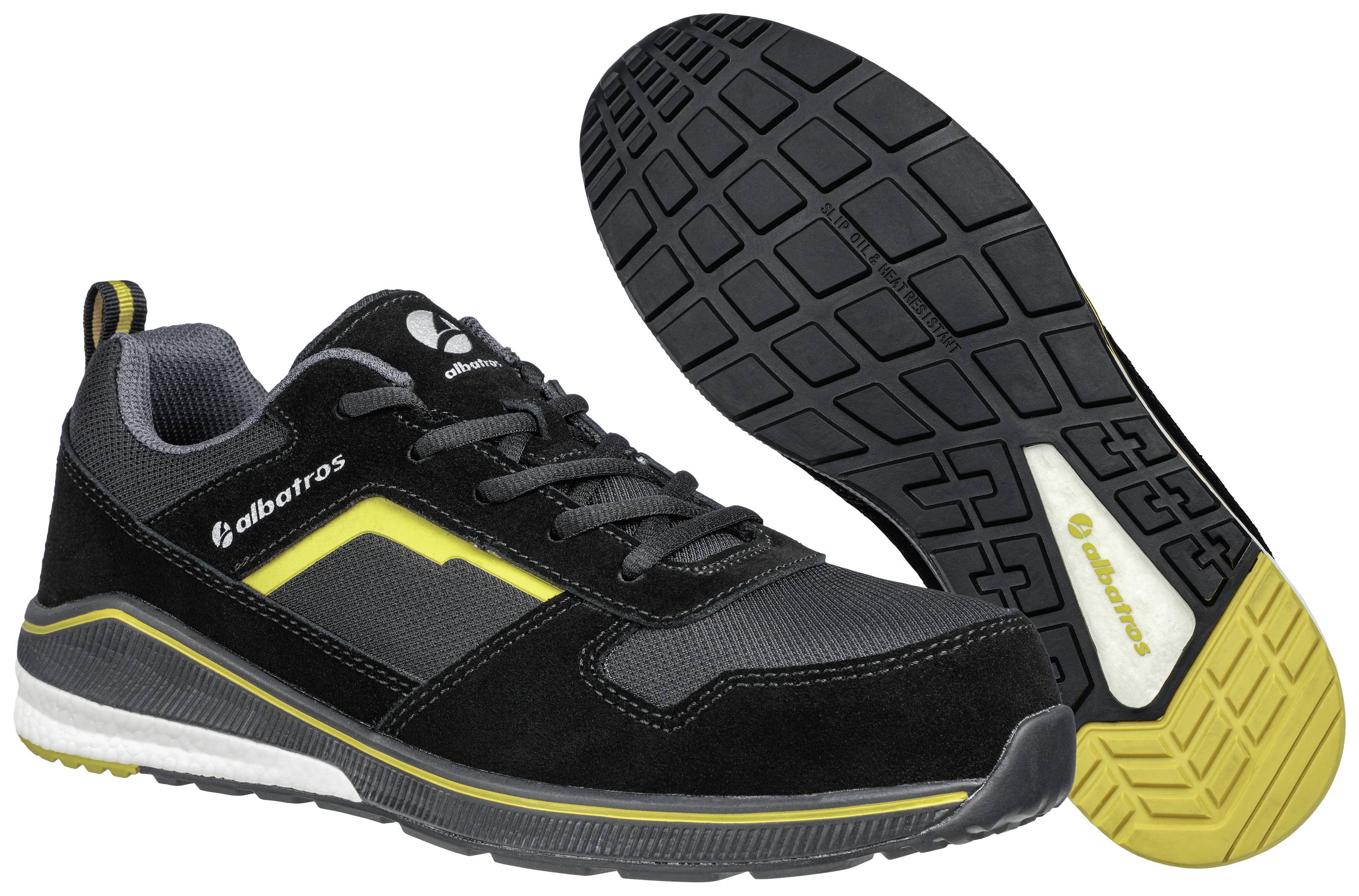Black and grey sports shoe, shown from the side and bottom, with a yellow accent line and non-slip sole.