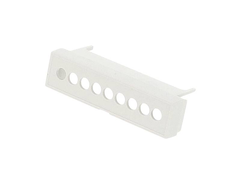 A white plastic adapter with eight circular openings arranged in a row.