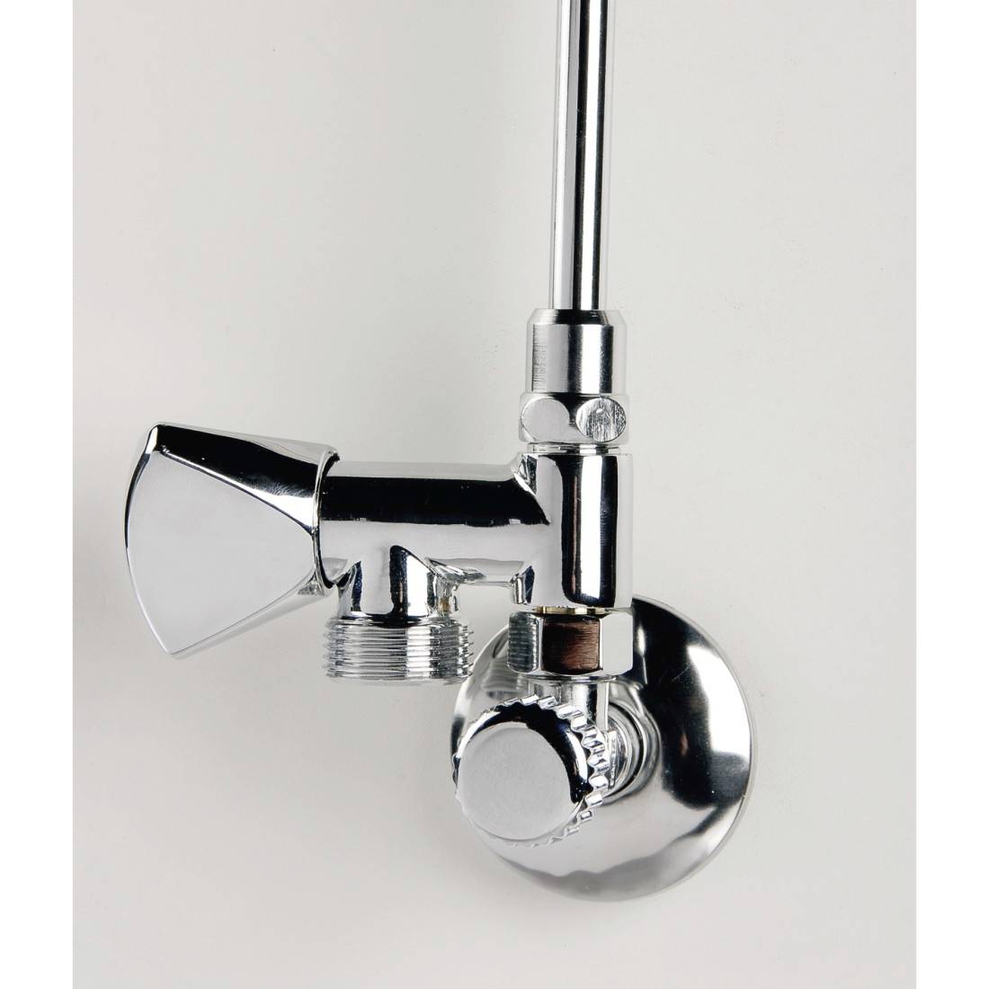 A silver angle valve mounted on a wall. It features a turning handle for regulating water flow in sanitary installations.
