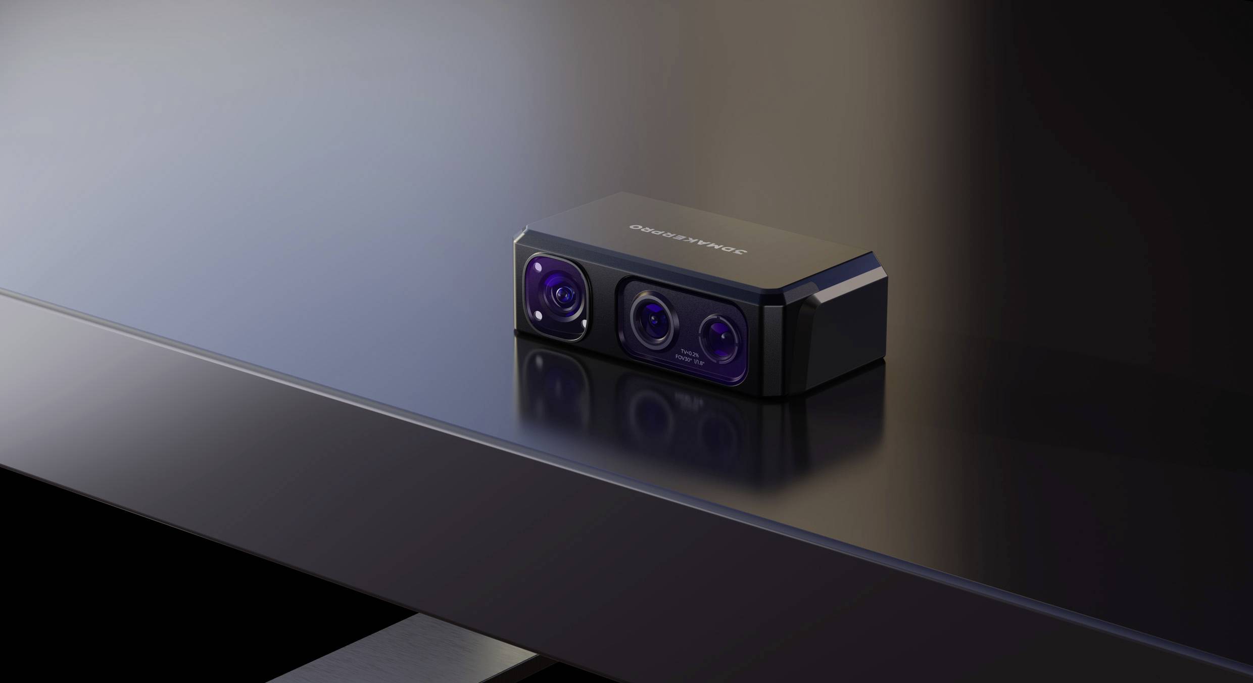 A small, black, rectangular camera with three lenses is lying on a dark table.