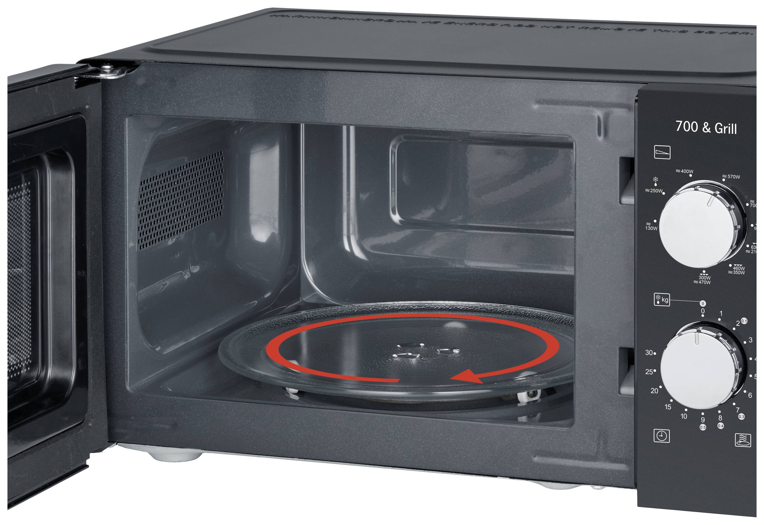 Microwave with open door, view of the turntable and control panel on the side.