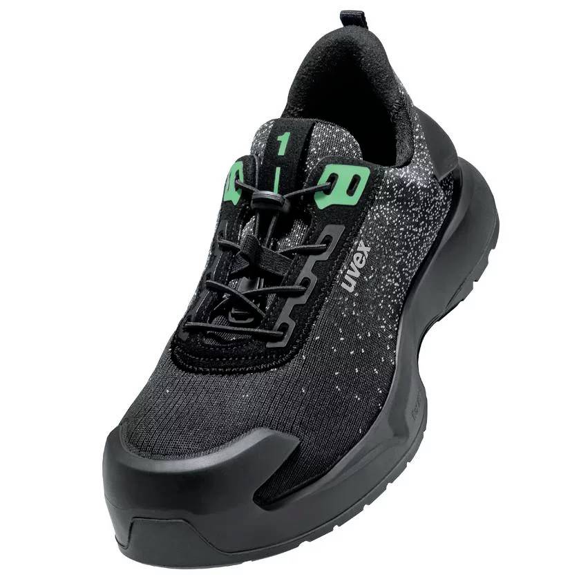 A black safety shoe with a modern design, green laces, and reinforced toe cap, suitable for construction and industrial work.