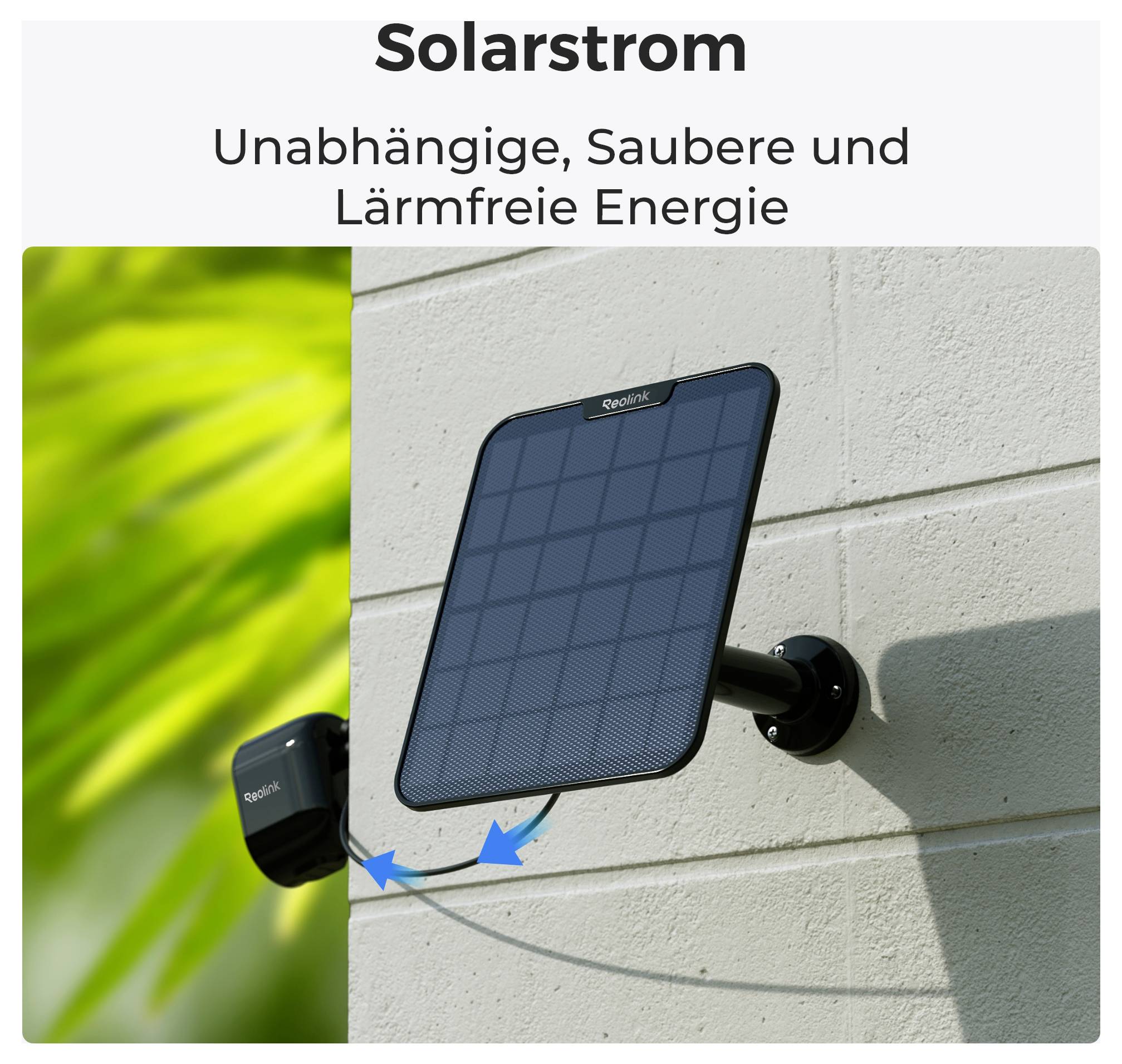 Solar panel mounted on a wall. Text: 'Solar Power - Independent, Clean and Noise-Free Energy'. Green foliage on the left side of the image.