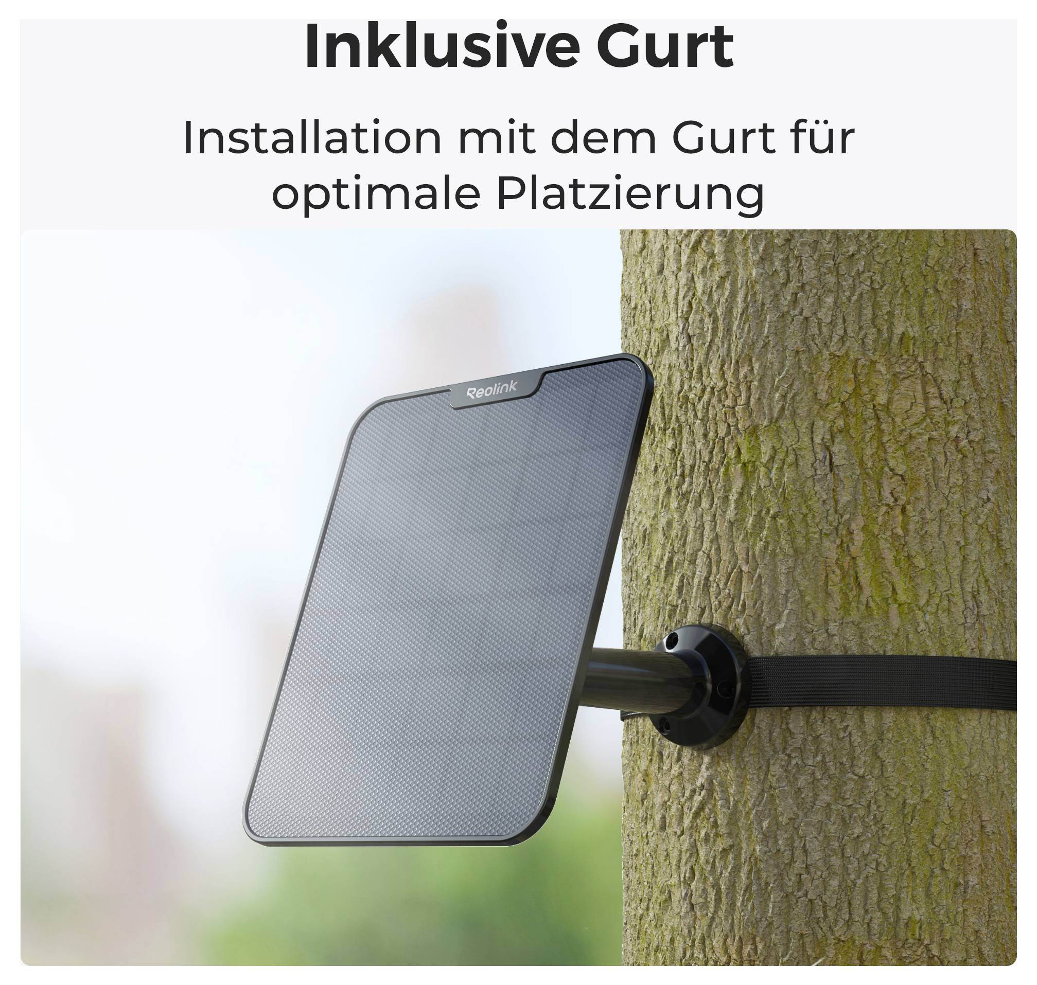 Solar panel secured with a strap on a tree trunk. Text above: Includes strap. Installation with the strap for optimal placement.