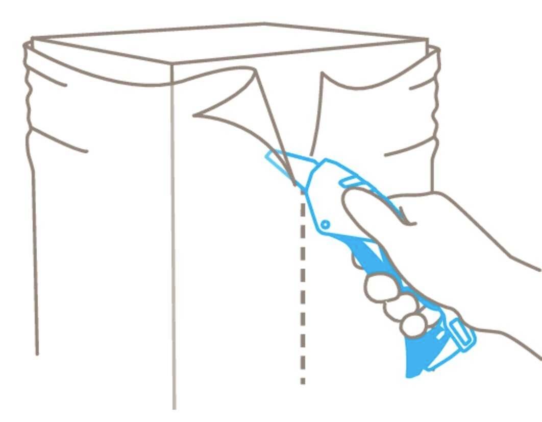 A hand holds a tool to open a rectangular package along a dotted line.
