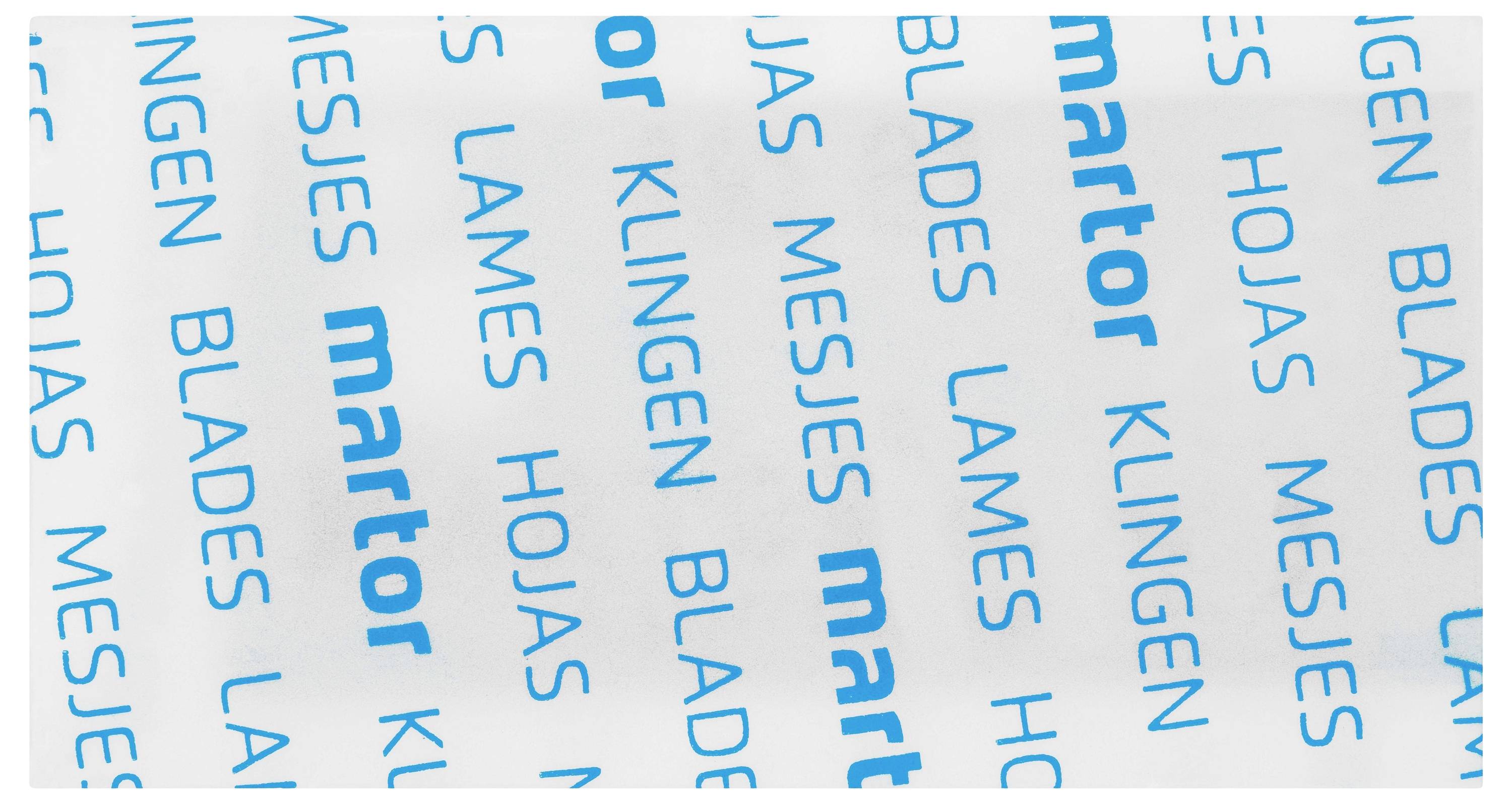 Packaging paper with repeated blue text 'martor', 'BLADES', 'MESJES', 'KLINGEN', 'HOJAS', 'LAMES' on a white background.