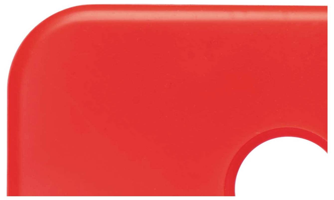 A bright red, rectangular object with rounded corners and a circular cut-out near one edge.