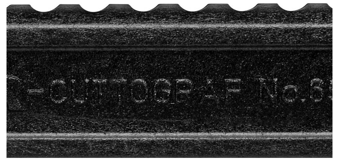 Close-up of a knife blade edge with visible text 'CUTT OGR-P-F No. 8'.