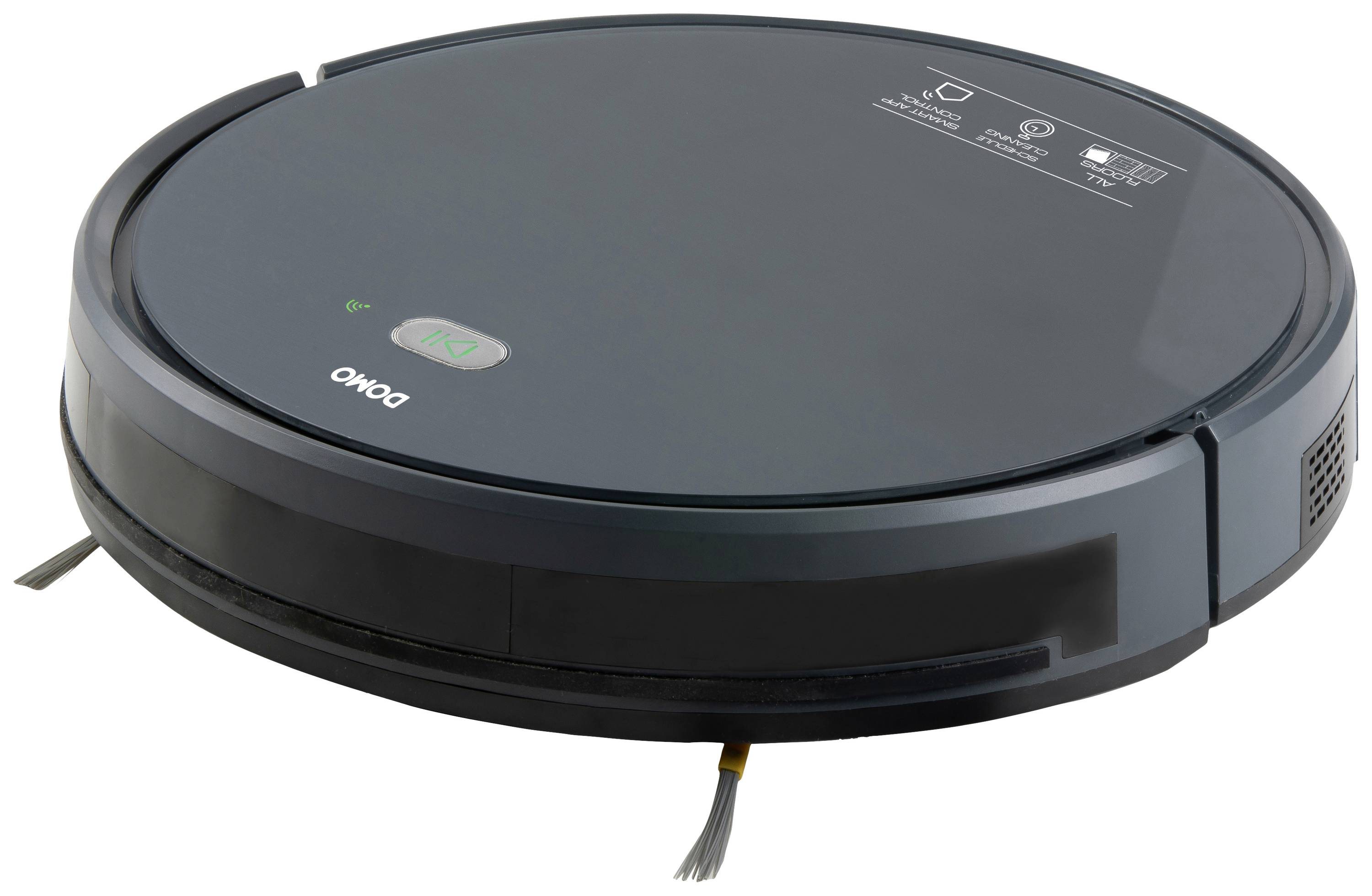 A round, flat robotic vacuum cleaner on a white background. It is black with small brushes protruding from its underside.