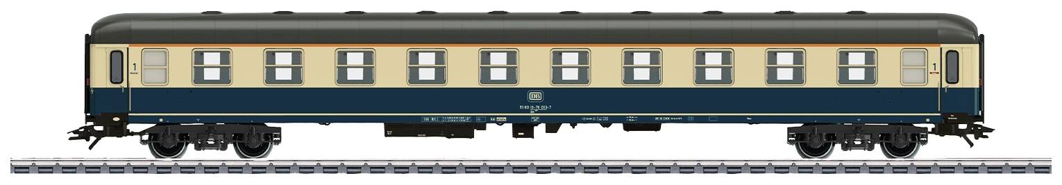 A blue and cream railway carriage of Deutsche Bundesbahn stands on tracks, side view, with multiple windows along its side.