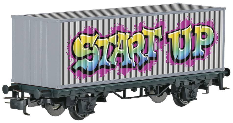 A goods wagon with the text 'Start Up' in colourful graffiti on the side, against a striped background.