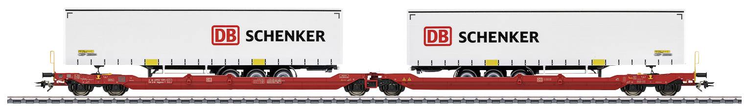 Two white DB Schenker containers on a goods wagon on railway tracks.