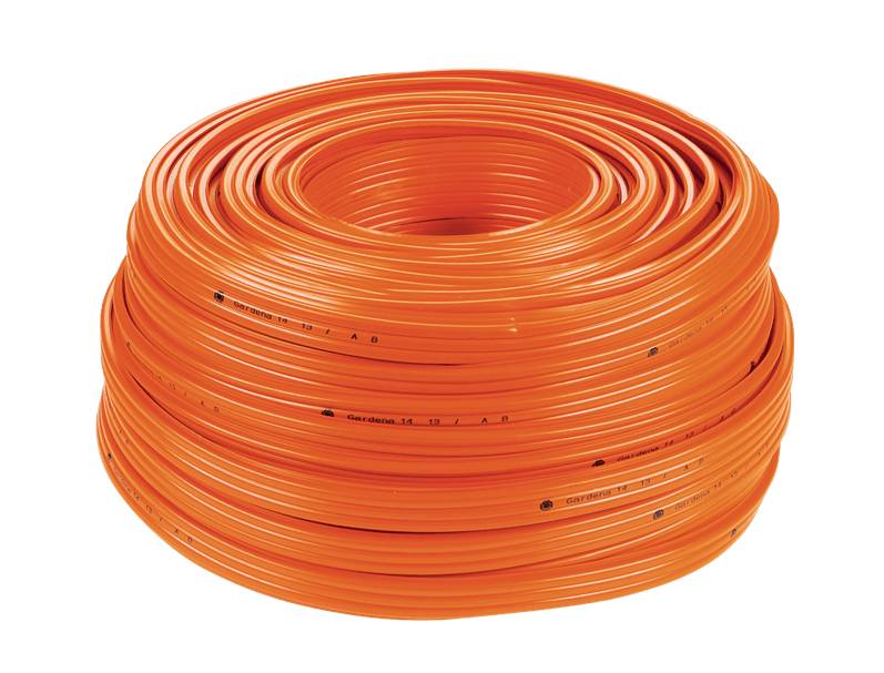 A large reel of orange cable, tightly tangled, on a white background.