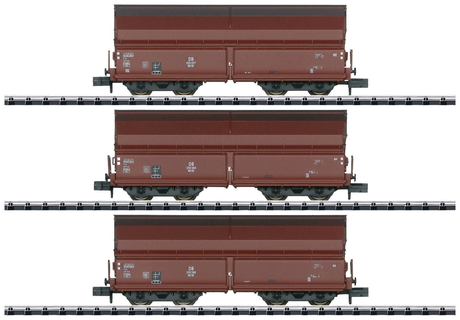 Three red goods wagons stacked on top of each other on railway tracks, with labelling and details on the sides of the wagons.