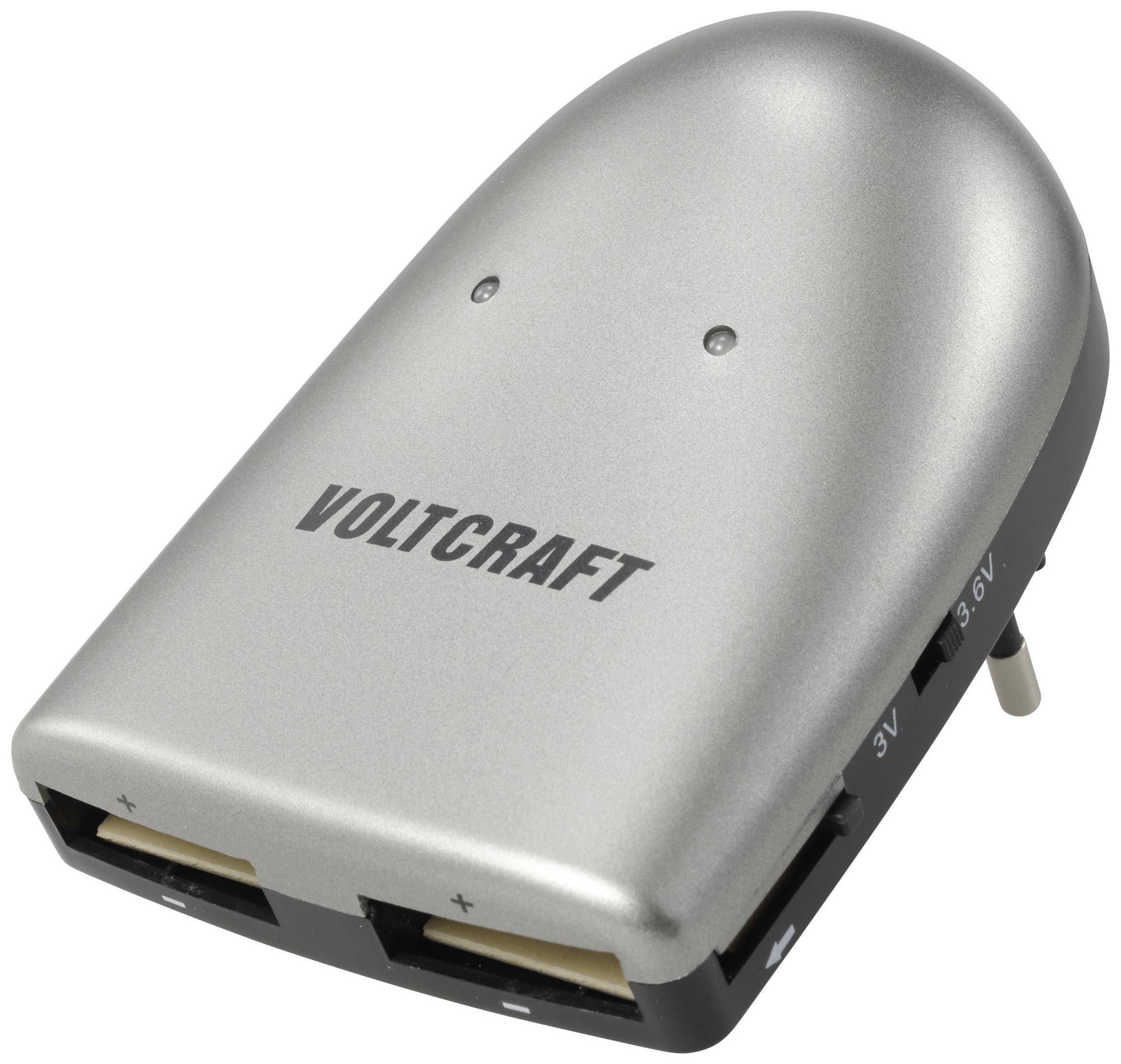 Silver Voltcraft charger with multiple voltage settings and cable connections. Ideal for electronic devices.