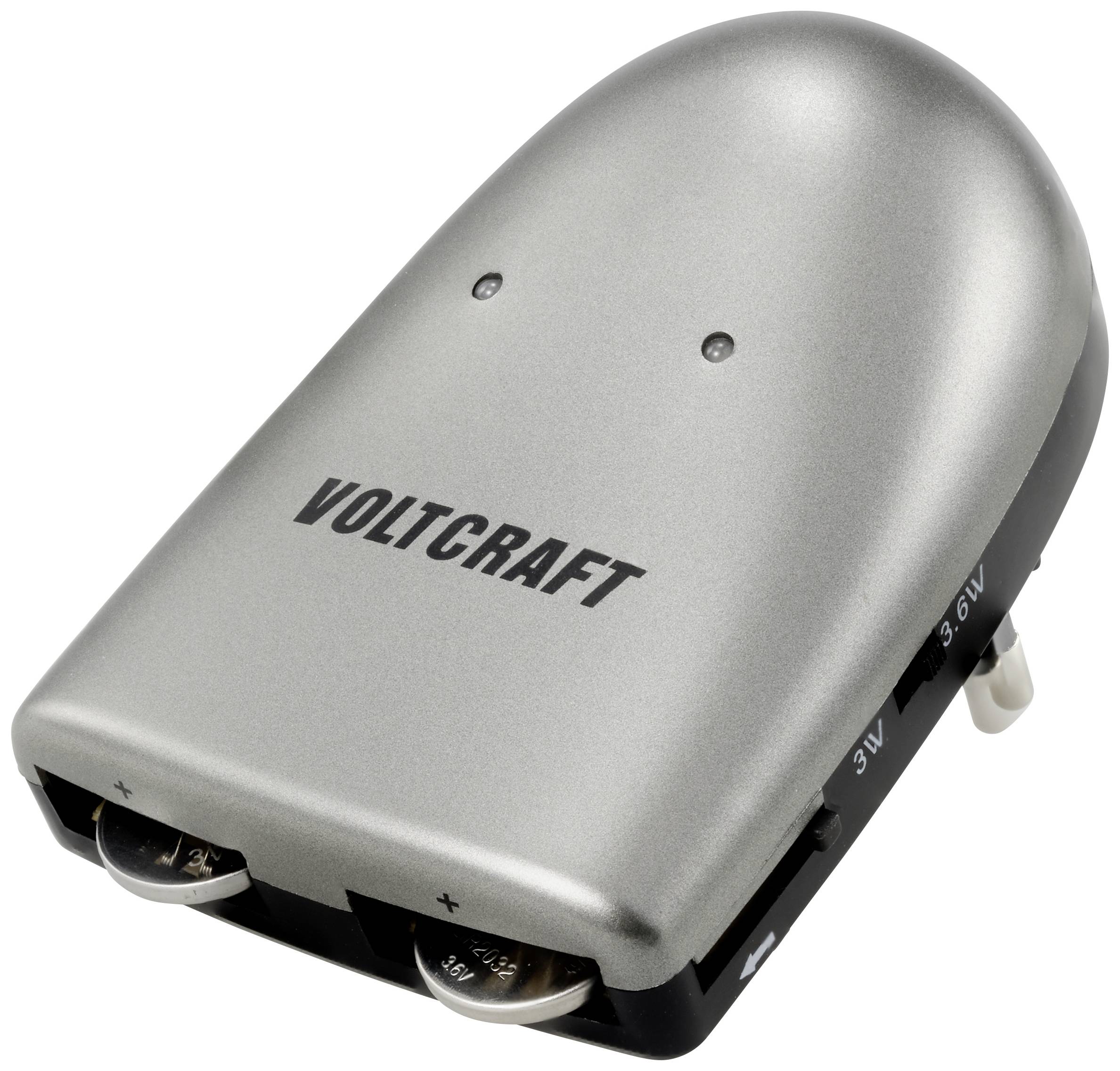 A silver battery charger by the brand 'Voltcraft' with settings for different voltages and two charging slots.