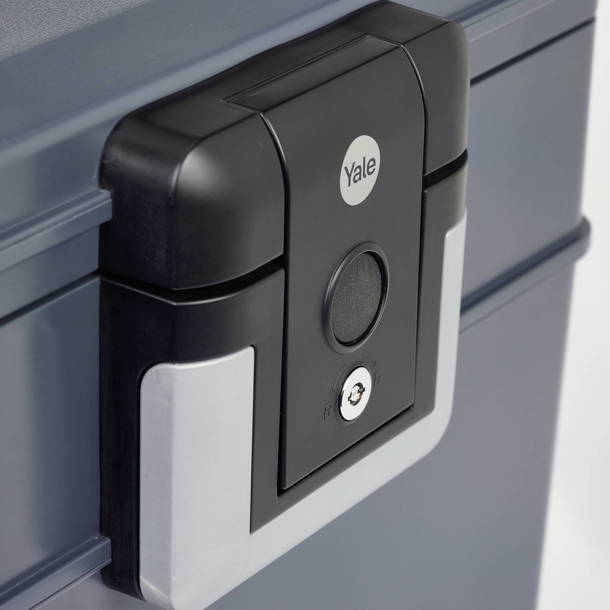 A dark grey safe with a digital lock by 'Yale', close-up of the lock area.