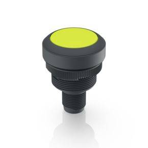 Round, black push button with luminous yellow surface, suitable for industrial applications or machine controls.