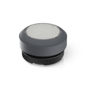 A grey, round, flat button lies on a white surface. The button has a ribbed base for better grip.