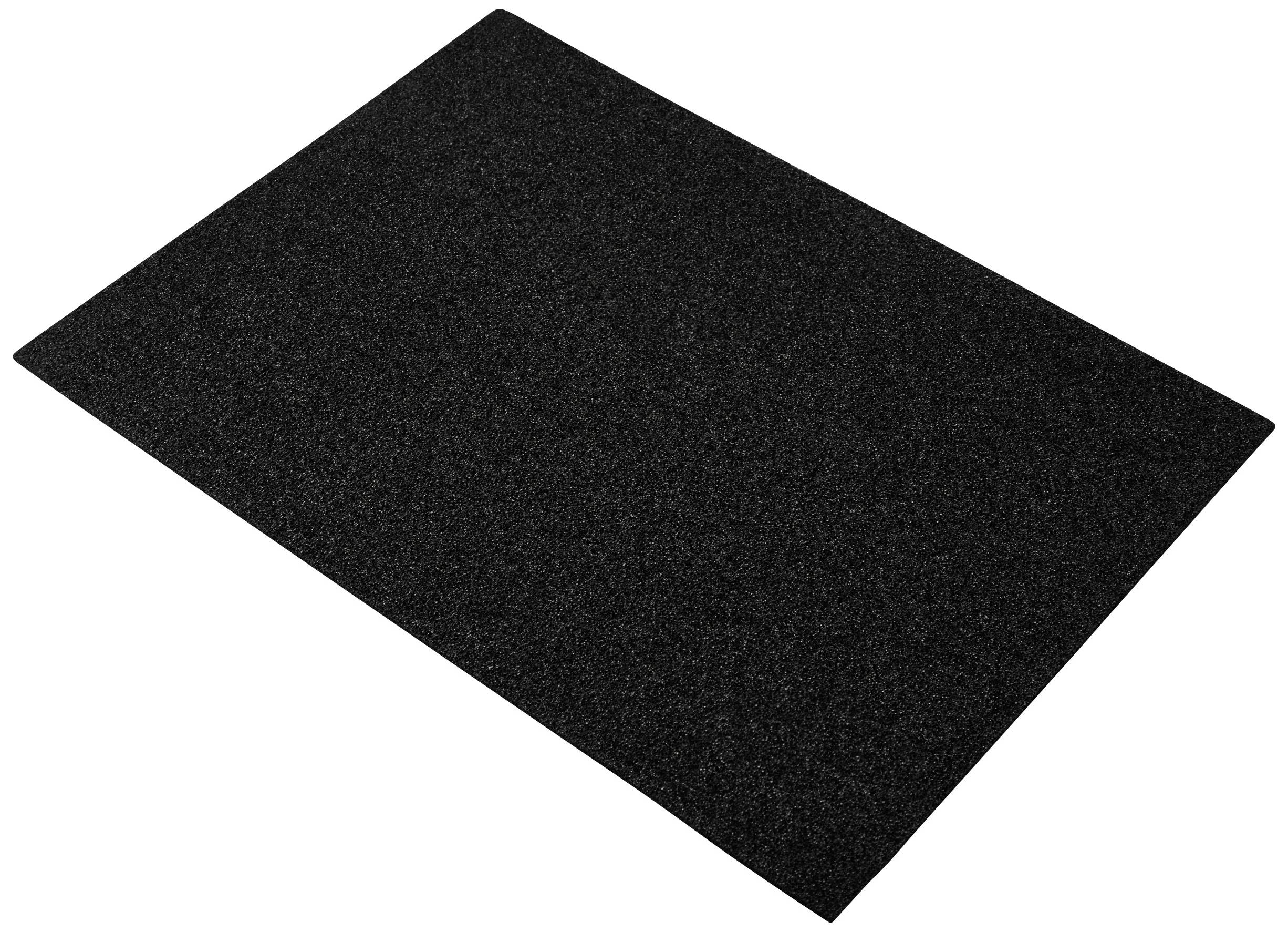 A rectangular black rectangular sheet, possibly made of foam or felt, lies flat on a white surface.