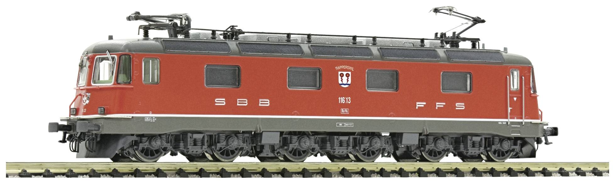 A red model of an SBB FFS electric locomotive on a track. It demonstrates the traditional design of Swiss railways.