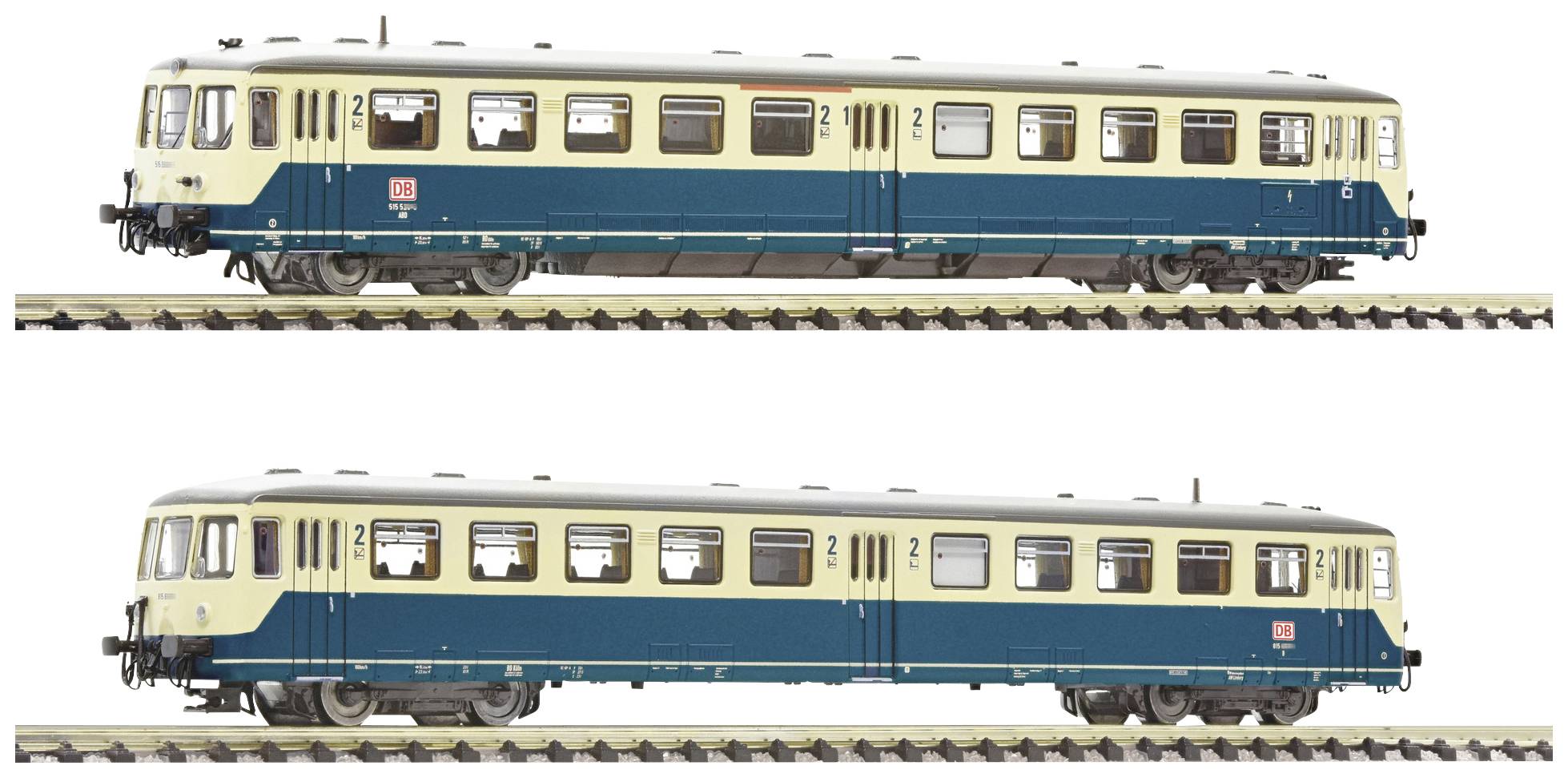 Two model railway trains in cream and blue, standing on tracks. Both have multiple windows and display typical German railway characteristics.