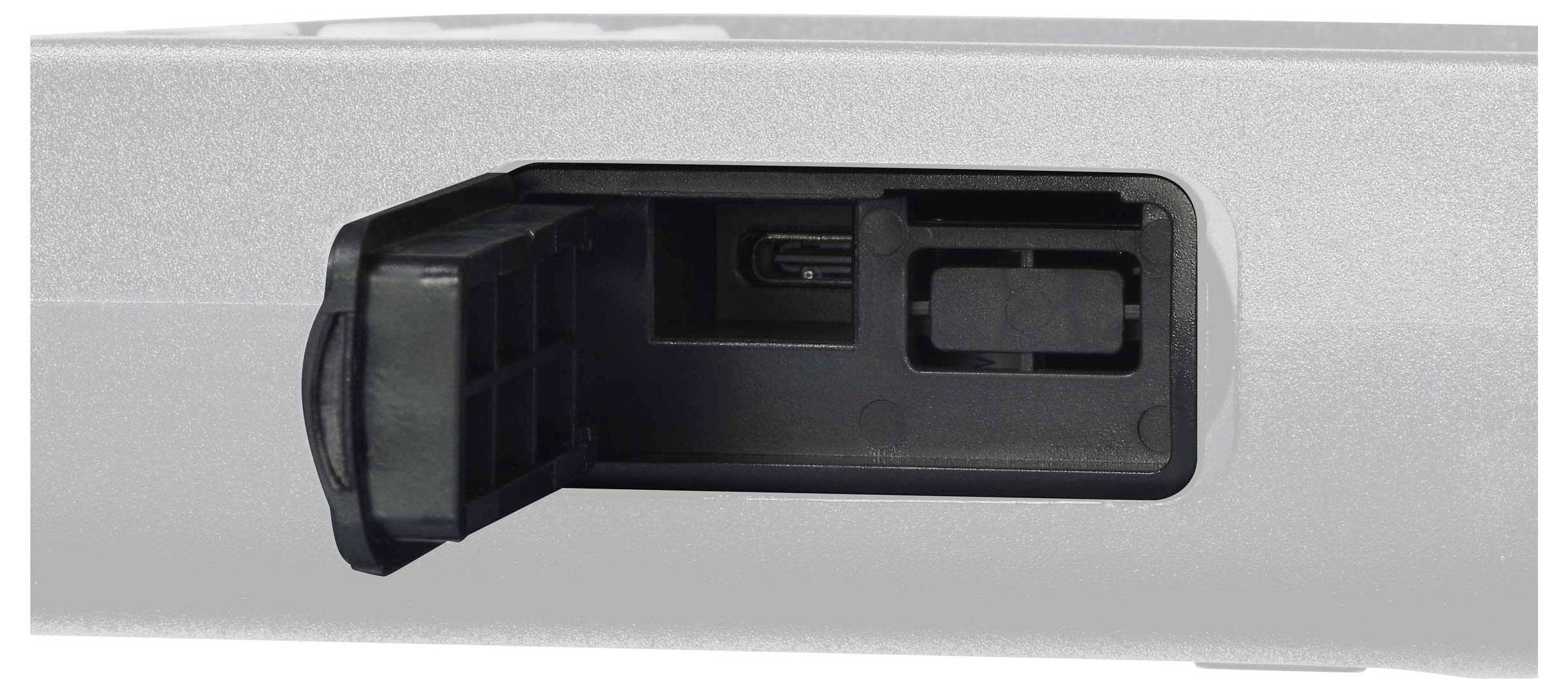 An open flap of a device showing a USB port.