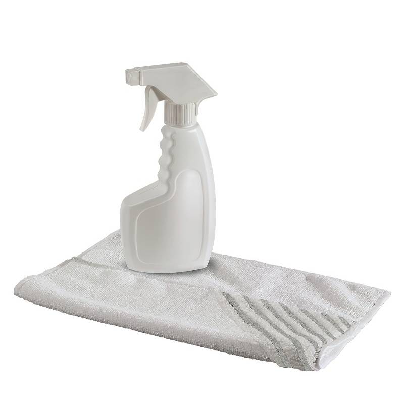 Spray bottle on a white cloth, ready for cleaning.Note: This translation is already in British English, so no changes were necessary.