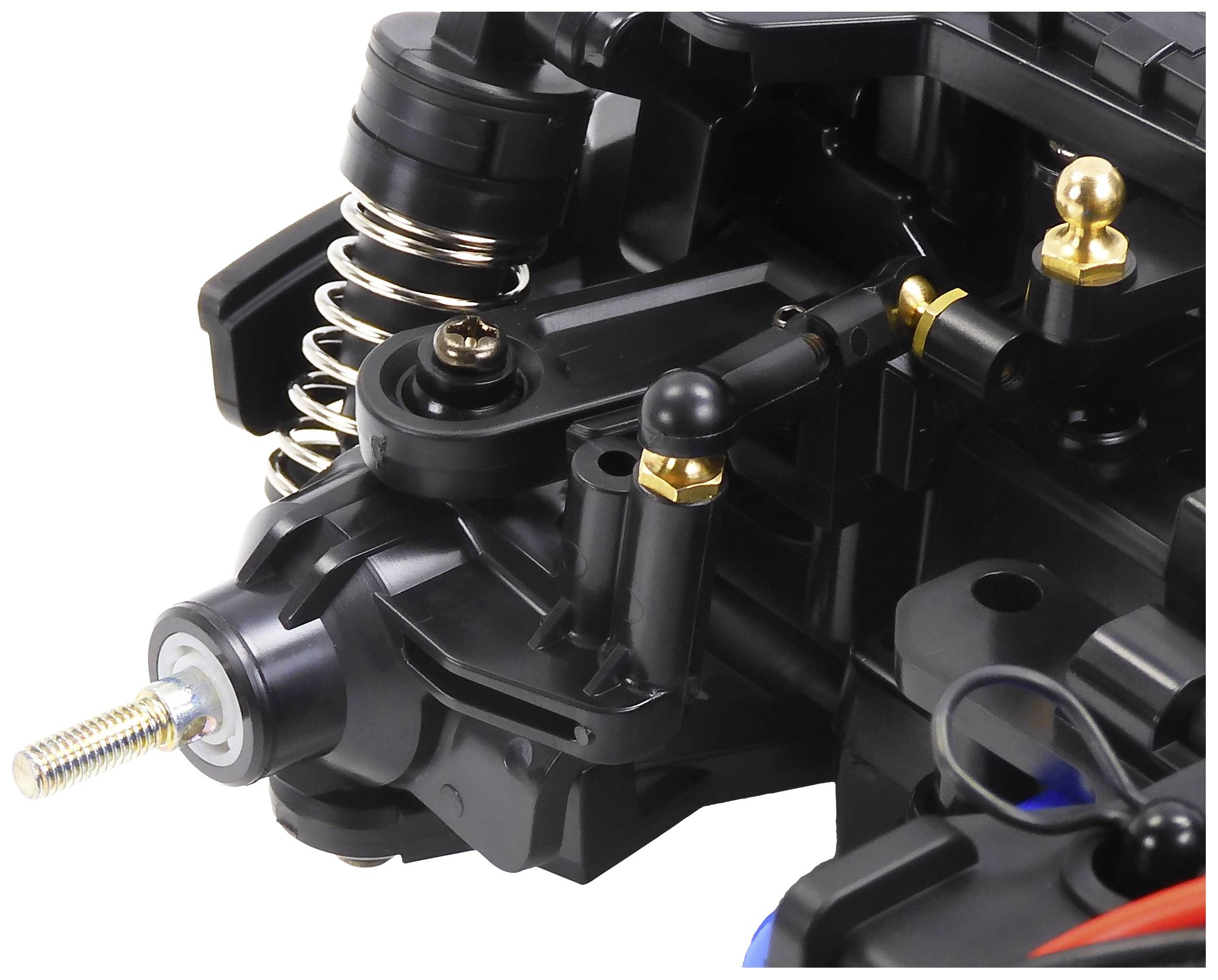 Close-up of a black plastic and metal mechanism with springs and screws, likely a component of a technical device.