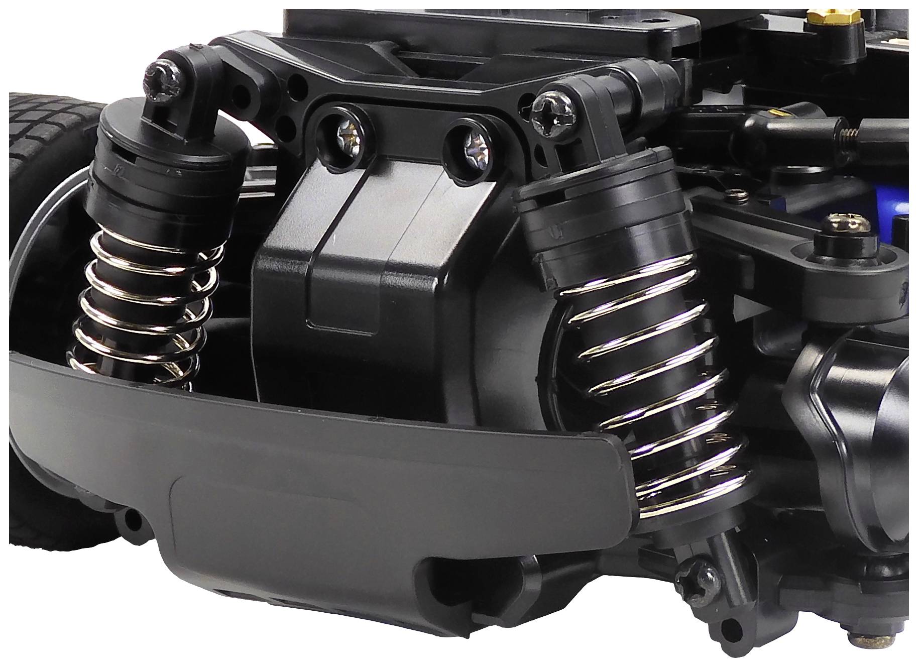 Close-up of the suspension system of a toy car with shock absorbers and springs that provide stability and damping.