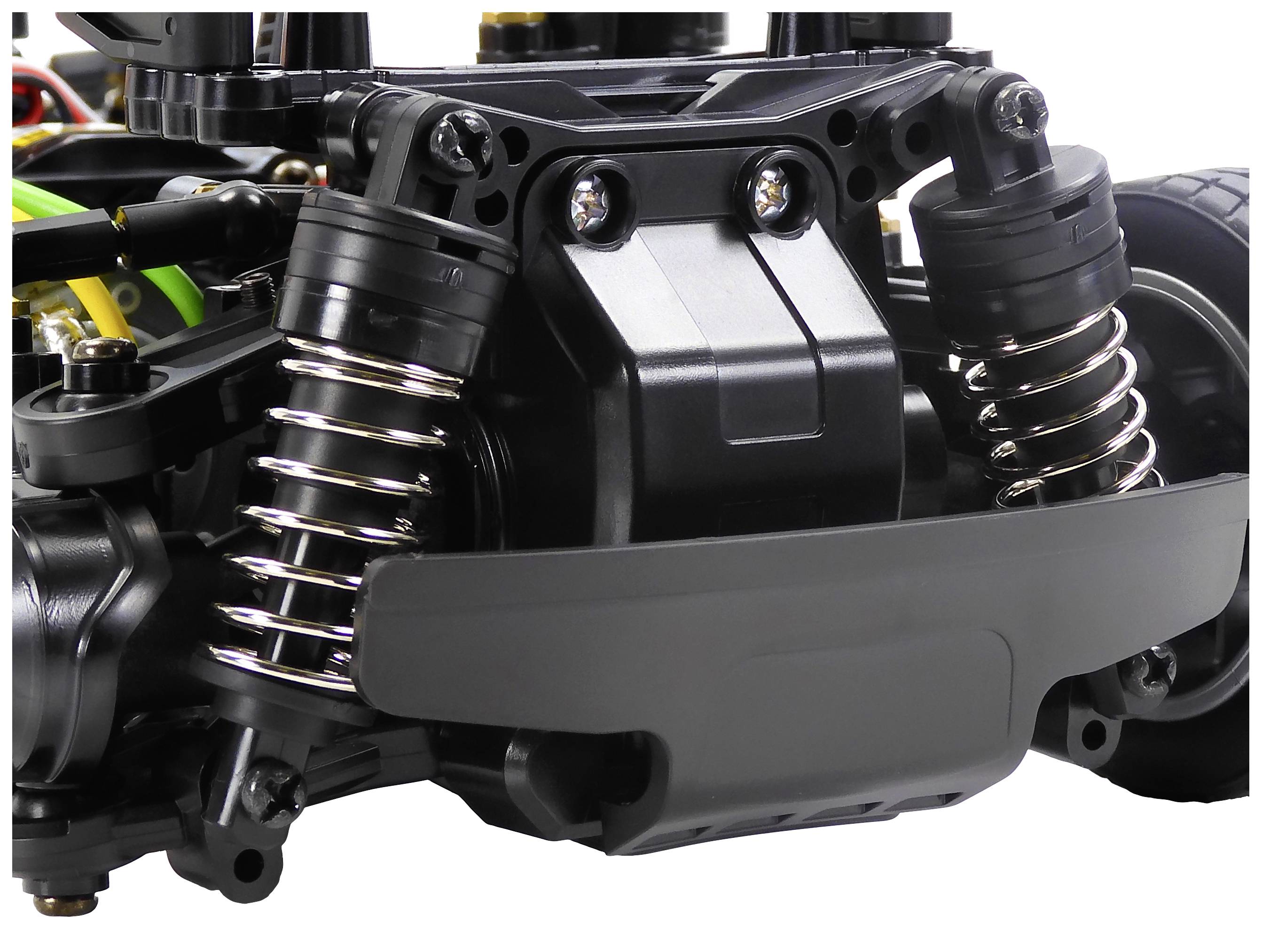 Close-up of an RC car suspension system with coil springs and dampers, providing stability and shock absorption.