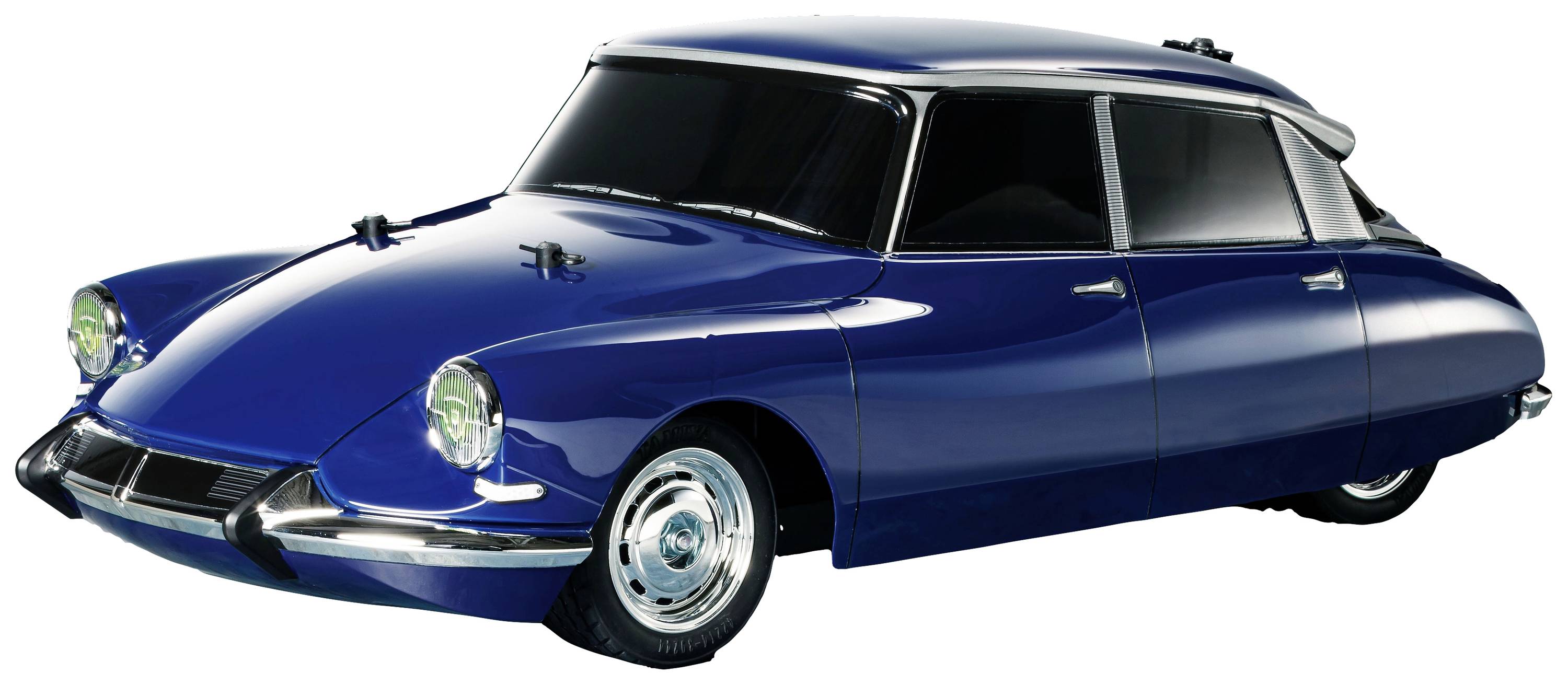 A blue vintage car with a curved design and round headlamps. The car is positioned sideways on a light background.