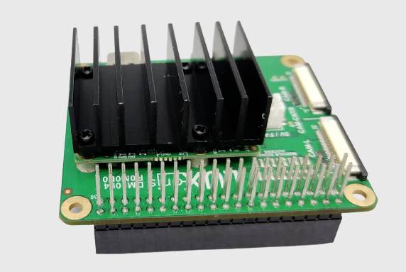 A green electronic module with a heatsink and numerous pins. It appears to be a computer or electronic component.