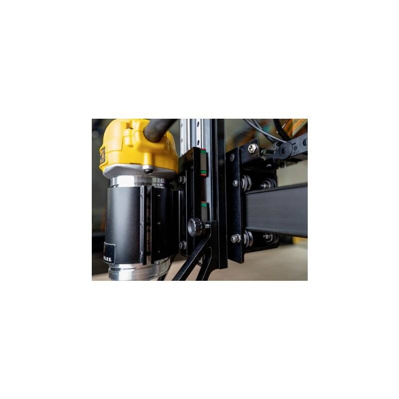 A CNC milling machine in close-up, during operation. The machine reveals precise mechanical components.