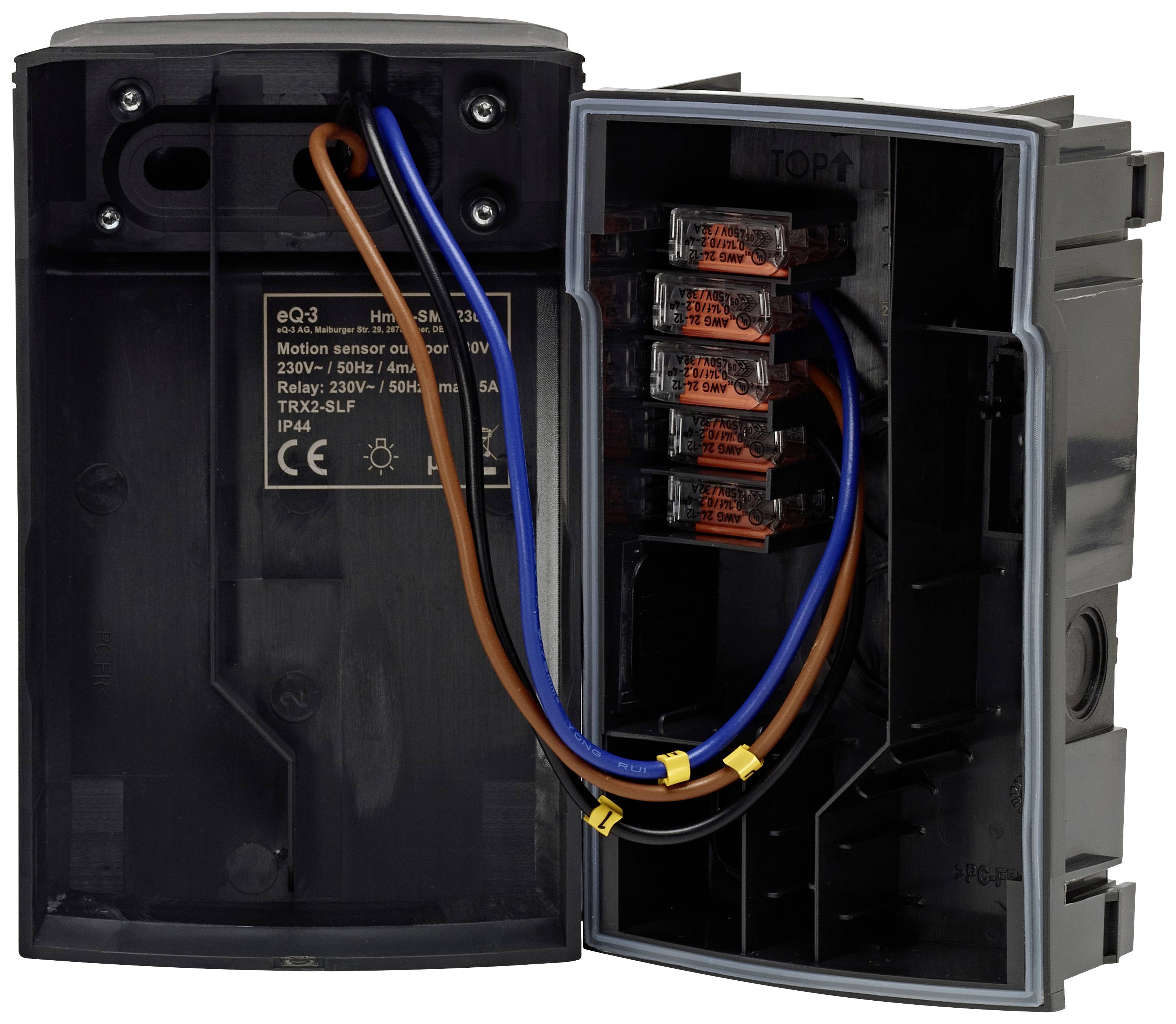 Electric motion sensor with open housing, showing the wiring and internal components. Includes text with technical specifications.