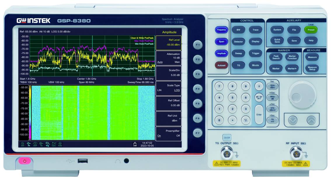 Analyser with a colour display showing frequency spectra; control buttons on the side for operating the device.