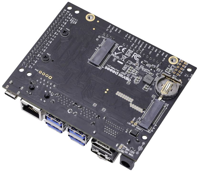 Circuit board with multiple USB ports, Ethernet connections, and a battery holder. This is a computer motherboard.