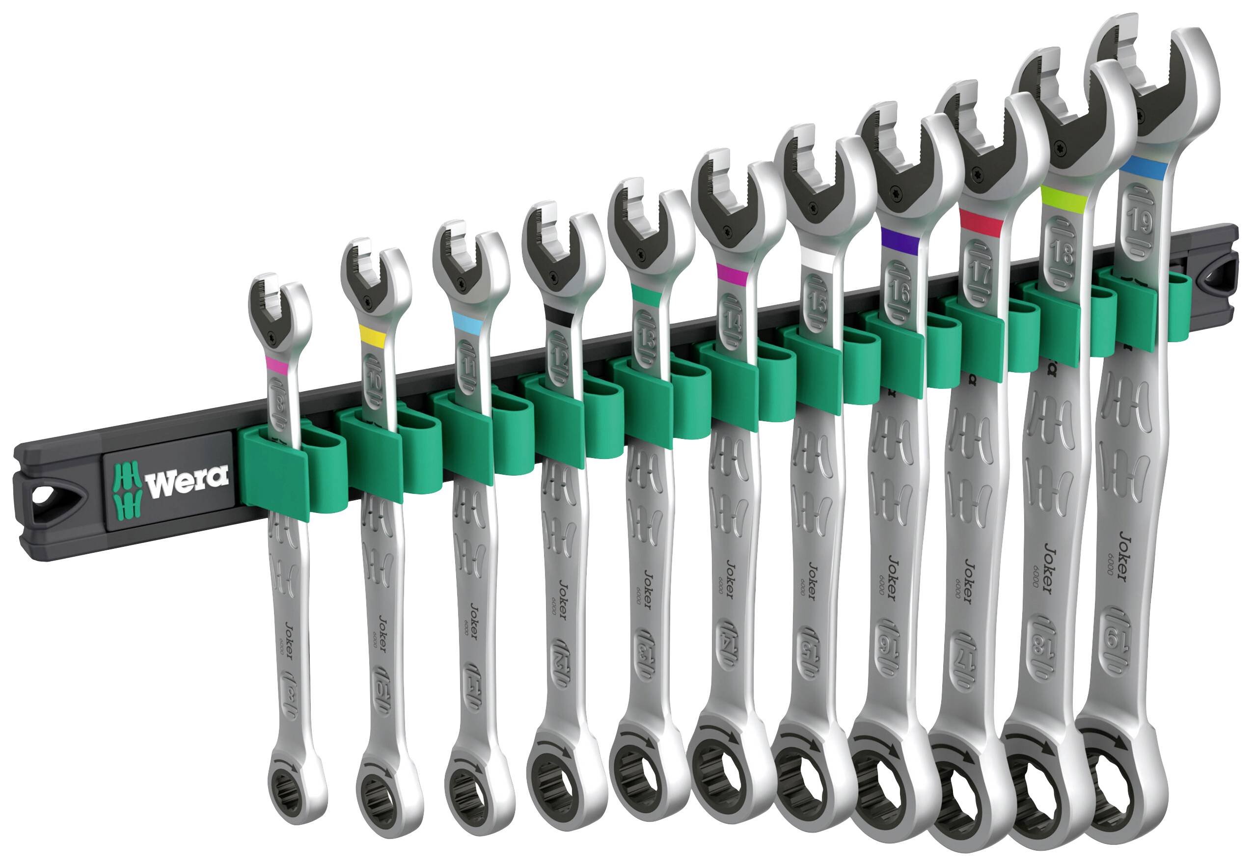 A set of eleven spanners in varying sizes, arranged in a green holder by the brand Wera.
