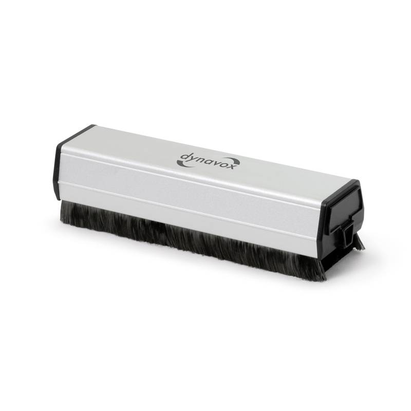 A silver plate brush with a black bristle border, used for cleaning vinyl records.