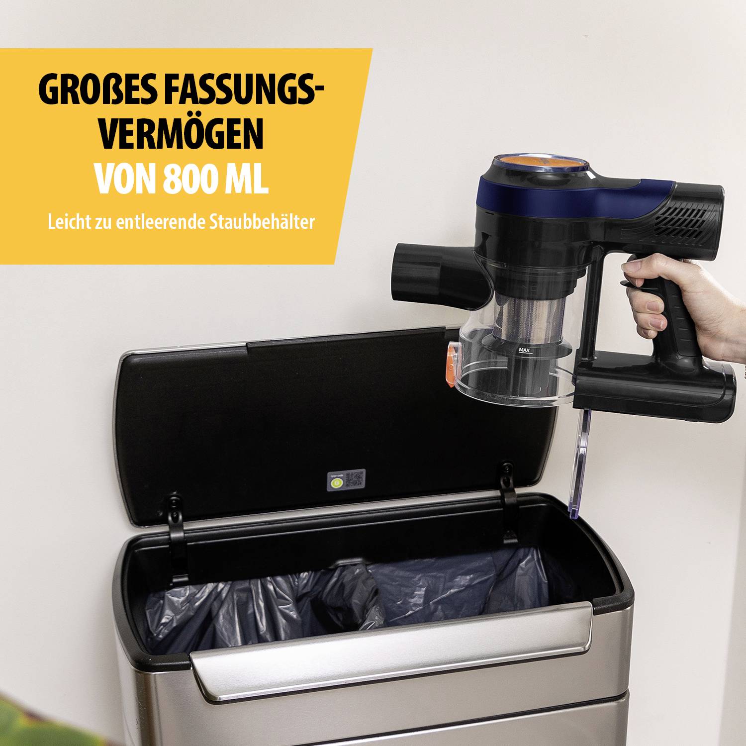 'Large capacity of 800 ml' reads a sign. A hand operates a vacuum cleaner, emptying its container into a dustbin.