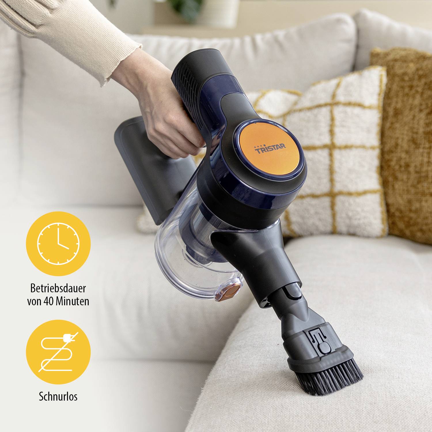 A person is holding a cordless handheld vacuum cleaner by Tristar above a sofa. Graphic shows: 'Operating time 40 minutes', 'Cordless'.