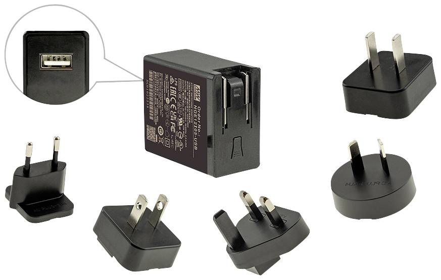 Multi-socket extension with various adapter plugs for international power sockets, suitable for travelling.